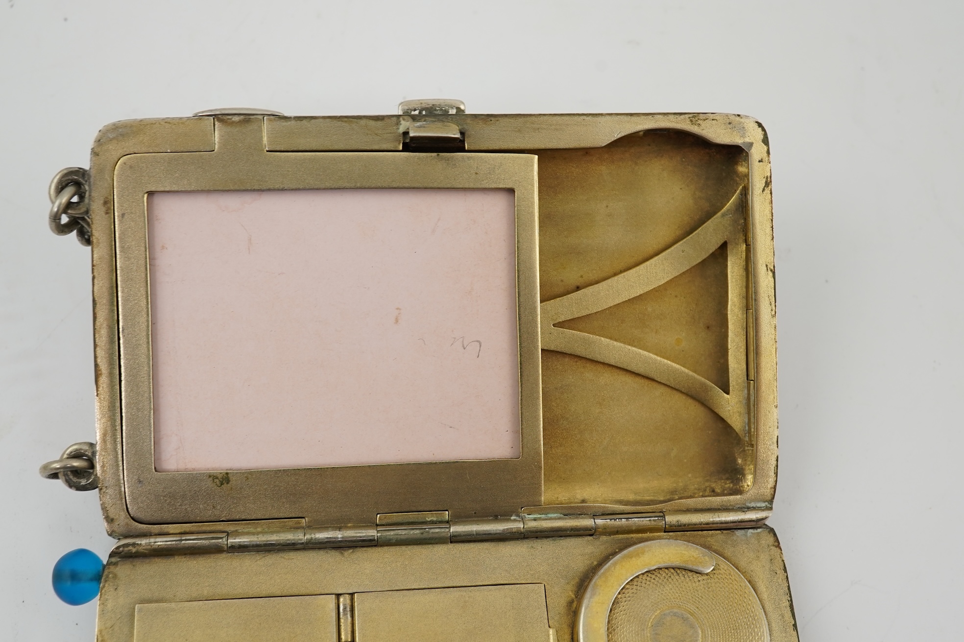 An early 20th century continental 800 standard silver combination, card, coin, aide memoir and pill case, with pencil and ribbed decoration, maker WK